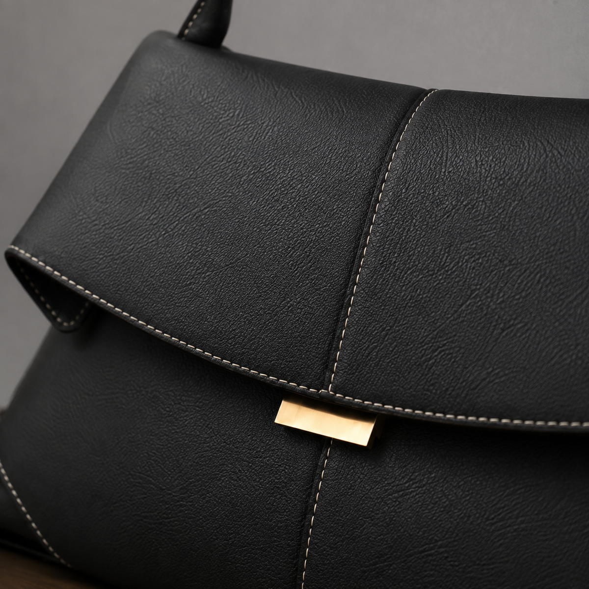 Peretti Sculpted Leather Handbag - Lead Product Detail